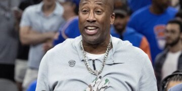 Head coach Mike Brown wears rapper Fat Joes’ chain as he addresses the crowd after the Knicks' 94-90 NBA title-clinching Game 5 win over the Spurs on July 13, 2026.
