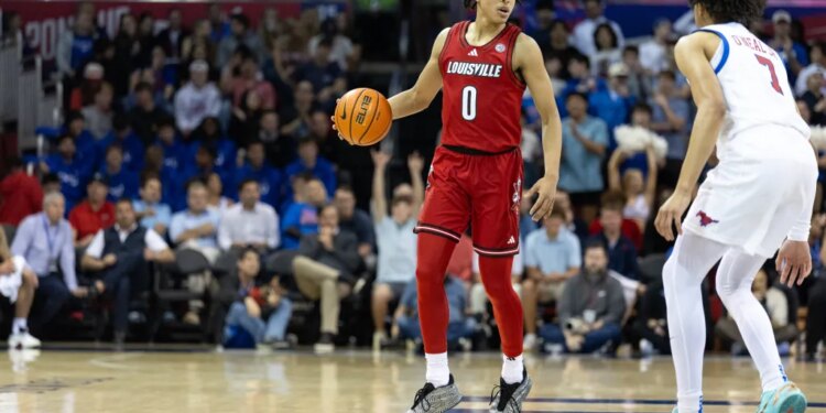 A Louisville player in a red jersey and a SMU player in a white jersey on the basketball court.