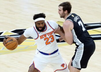 Mitchell Robinson looks to make a move on Luke Kornet during the first quarter of the Knicks' 105-95 Game 1 win over the Spurs in the NBA Finals on June 3, 2026 in San Antonio.