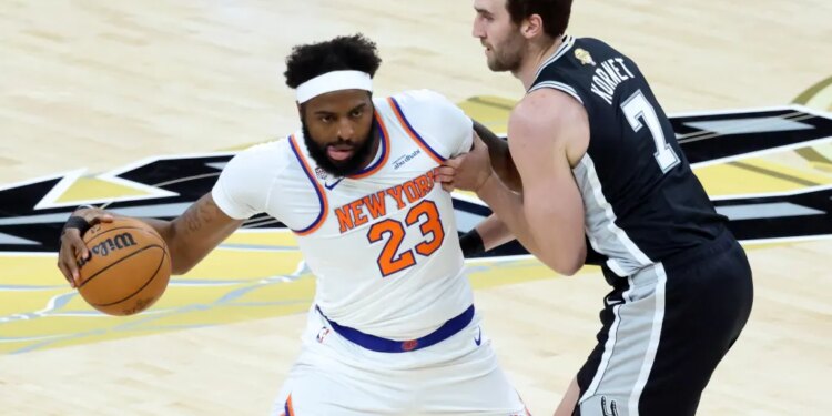 Mitchell Robinson looks to make a move on Luke Kornet during the first quarter of the Knicks' 105-95 Game 1 win over the Spurs in the NBA Finals on June 3, 2026 in San Antonio.