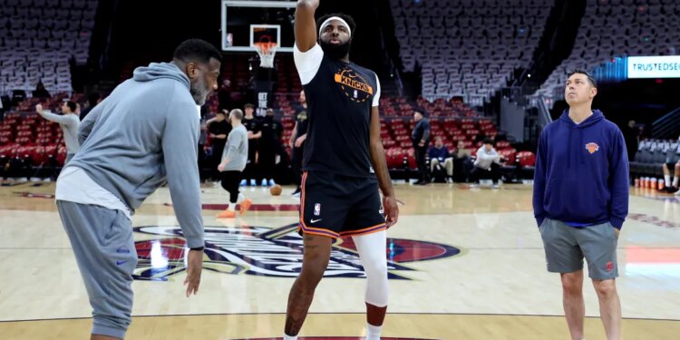 New York Knicks center Mitchell Robinson practices free throws during warm-ups.