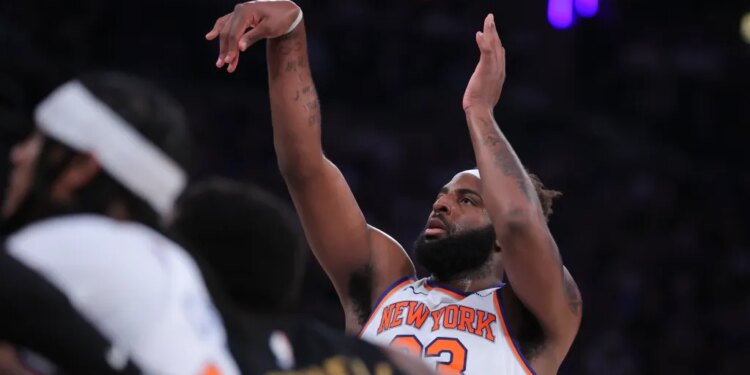 New York Knicks center Mitchell Robinson (23) shooting a free throw.
