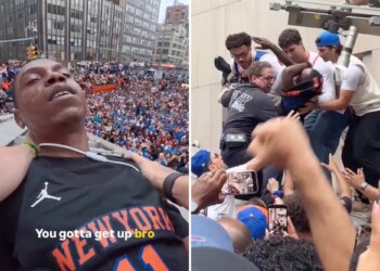 Moment Knicks fans climb structure to save reveler from apparent overdose during championship parade