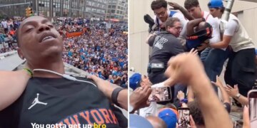 Moment Knicks fans climb structure to save reveler from apparent overdose during championship parade
