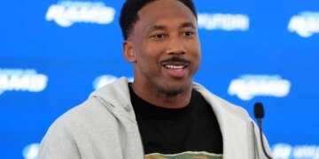 Rams defensive end Myles Garrett talks to reporters at a press conference at the team's practice facility on June 2026.