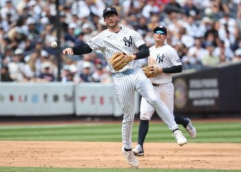 Ryan McMahon, who is now on the IL, makes a putout during a Yankees' game against the Reds this past weekend.