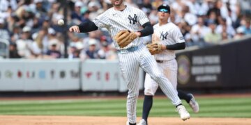 Ryan McMahon, who is now on the IL, makes a putout during a Yankees' game against the Reds this past weekend.