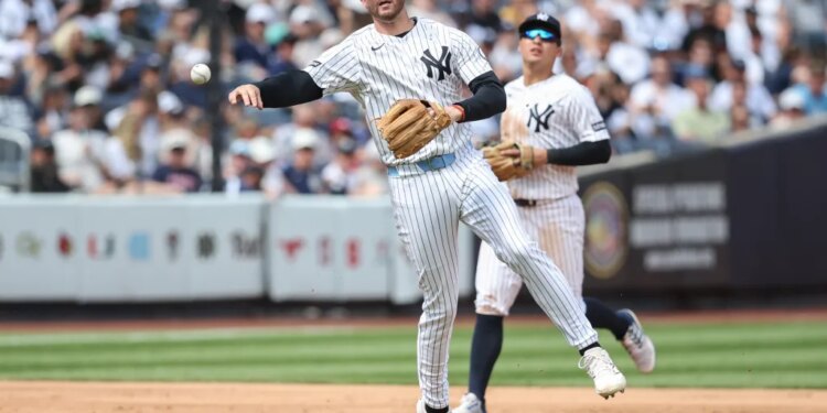 Ryan McMahon, who is now on the IL, makes a putout during a Yankees' game against the Reds this past weekend.