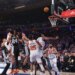 New York Knicks forward OG Anunoby #8 falls to the floor after scoring the game-winning basket as New York Knicks center Karl-Anthony Towns #32 watches the ball go through the net during game 4 of the 2026 NBA Finals against the San Antonio Spurs at Madison Square Garden.