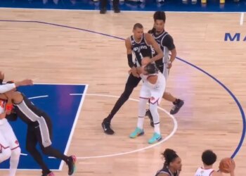 The Spurs' Victor Wembanyama (1) shoves Knicks guard Jalen Brunson (11) in the back of the head during Game 3 of the NBA Finals on June 8, 2026.