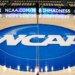 NCAA logo painted on a basketball court.