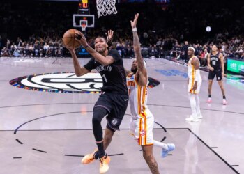 Brooklyn Nets forward Ziaire Williams shoots the ball over Atlanta Hawks guard Nickeil Alexander-Walker.