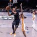 Brooklyn Nets forward Ziaire Williams shoots the ball over Atlanta Hawks guard Nickeil Alexander-Walker.