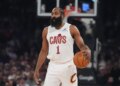 James Harden holding a basketball during an NBA game.