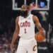 James Harden holding a basketball during an NBA game.