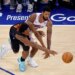 New York Knicks forward Og Anunoby (8) knocks the ball away from Philadelphia 76ers forward Paul George (8).