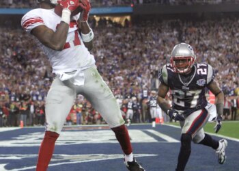 Former Giants receiver Plaxico Burress catches a game-winning pass from Eli Manning in Super Bowl 42.