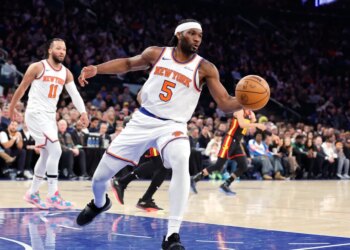 New York Knicks forward Precious Achiuwa rebounds the ball during the first quarter.