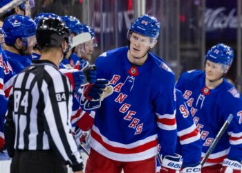 New York Rangers center Adam Edstrom (84) celebrates his goal with the team in the second period against the New Jersey Devils at Madison Square Garden, Thursday, Oct. 2, 2025, in New York, NY.