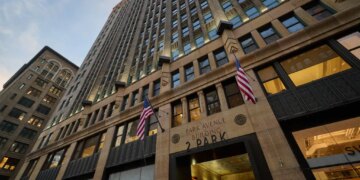 The Park Avenue Building at 2 Park Avenue, with flags outside the building.