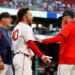 Boston Red Sox interim manager Chad Tracy holds back Willson Contreras after Contreras was ejected for contesting a call.