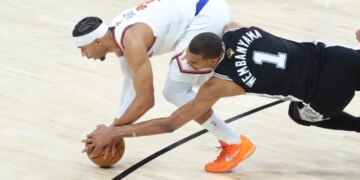 New York Knicks guard Josh Hart steals the ball from San Antonio Spurs forward Victor Wembanyama in the second half of NBA Finals Game 1
