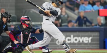 New York Yankees center fielder Trent Grisham hitting an RBI double.