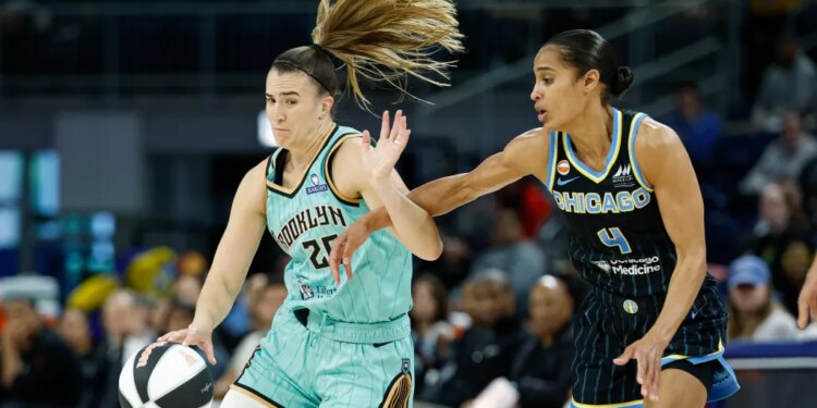 Sabrina Ionescu, who later scored the game-winning layup, drives on Skylar Diggins during the Liberty's 96-95 win over the Sky on June 17, 2026 in Chicago.