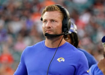 Los Angeles Rams head coach Sean McVay wearing a headset on the sideline.