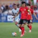 Republic of Korea forward Son Heung-Min (13) looks to pass against El Salvador.