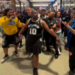Cops escort the Spurs fan away on June 13, 2026.
