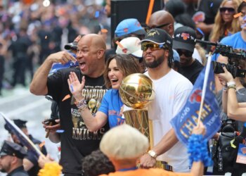 Jalen Brunson #11, Mariska Hargitay, and Rick Brunson celebrating the New York Knicks' 2026 NBA championship.