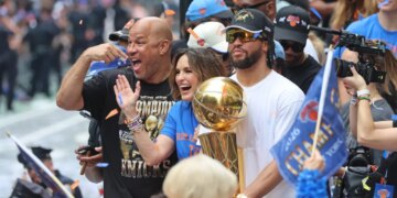 Jalen Brunson #11, Mariska Hargitay, and Rick Brunson celebrating the New York Knicks' 2026 NBA championship.