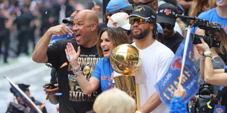 Jalen Brunson #11, Mariska Hargitay, and Rick Brunson celebrating the New York Knicks' 2026 NBA championship.