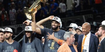 Karl-Anthony Towns celebrates the Knicks winning the NBA championship.
