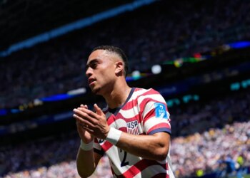 United States' Sergino Dest claps after being substituted during a soccer match.