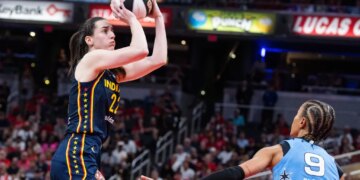 Caitlin Clark, who had 32 points and 10 assists, shoots a jumper over Natasha Cloud during the Fever's 114-106 win over the Sky on June 11, 2026 in Indianapolis.