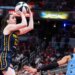Caitlin Clark, who had 32 points and 10 assists, shoots a jumper over Natasha Cloud during the Fever's 114-106 win over the Sky on June 11, 2026 in Indianapolis.