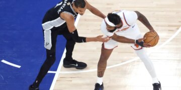 San Antonio Spurs forward Victor Wembanyama (1) defends against New York Knicks center Mitchell Robinson (23) during the first quarter of Game 4.