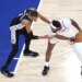 San Antonio Spurs forward Victor Wembanyama (1) defends against New York Knicks center Mitchell Robinson (23) during the first quarter of Game 4.