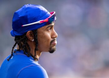 New York Mets player Francisco Lindor reacts in the dugout.
