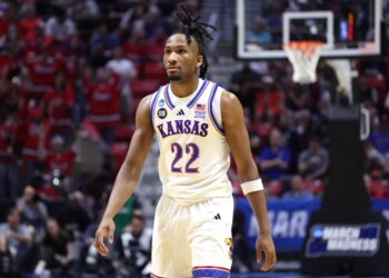 Guard Darryn Peterson #22 of the Kansas Jayhawks reacts on the court.