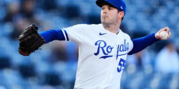 Kansas City Royals starting pitcher Cole Ragans throws during the first inning of a baseball game against the Cleveland Guardians.