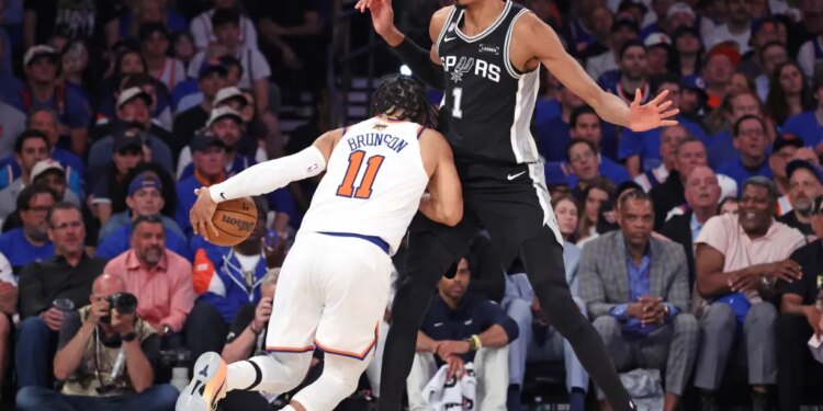 San Antonio Spurs forward Victor Wembanyama #1 defends against New York Knicks guard Jalen Brunson #11 during the second quarter.