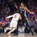 San Antonio Spurs forward Victor Wembanyama #1 defends against New York Knicks guard Jalen Brunson #11 during the second quarter.