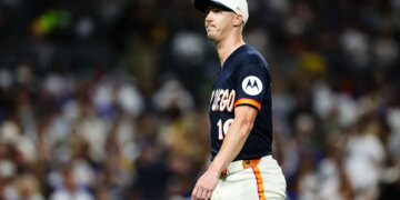 Baseball player Joe Musgrove in a Padres jersey on the field.