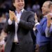 Warriors owner Joe Lacob clapping and smiling, with general manager Mike Dunleavy Jr. laughing next to him.