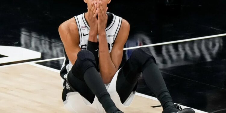 Victor Wembanyama reacts dejectly after a play during the Spurs' 94-90 NBA season-ending Game 5 loss to the Knicks on June 13, 2026 in San Antonio.