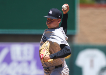 Will Warren, a New York Yankees pitcher, throws a baseball.