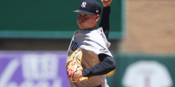 Will Warren, a New York Yankees pitcher, throws a baseball.